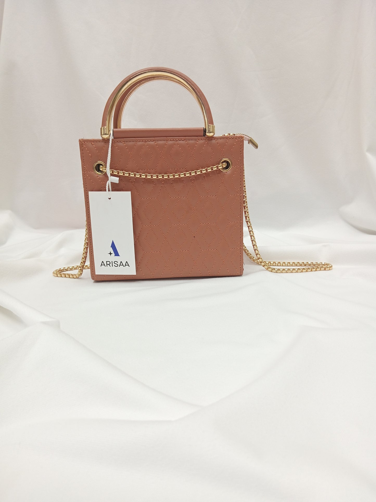Luxurious tan handbag with gold chain