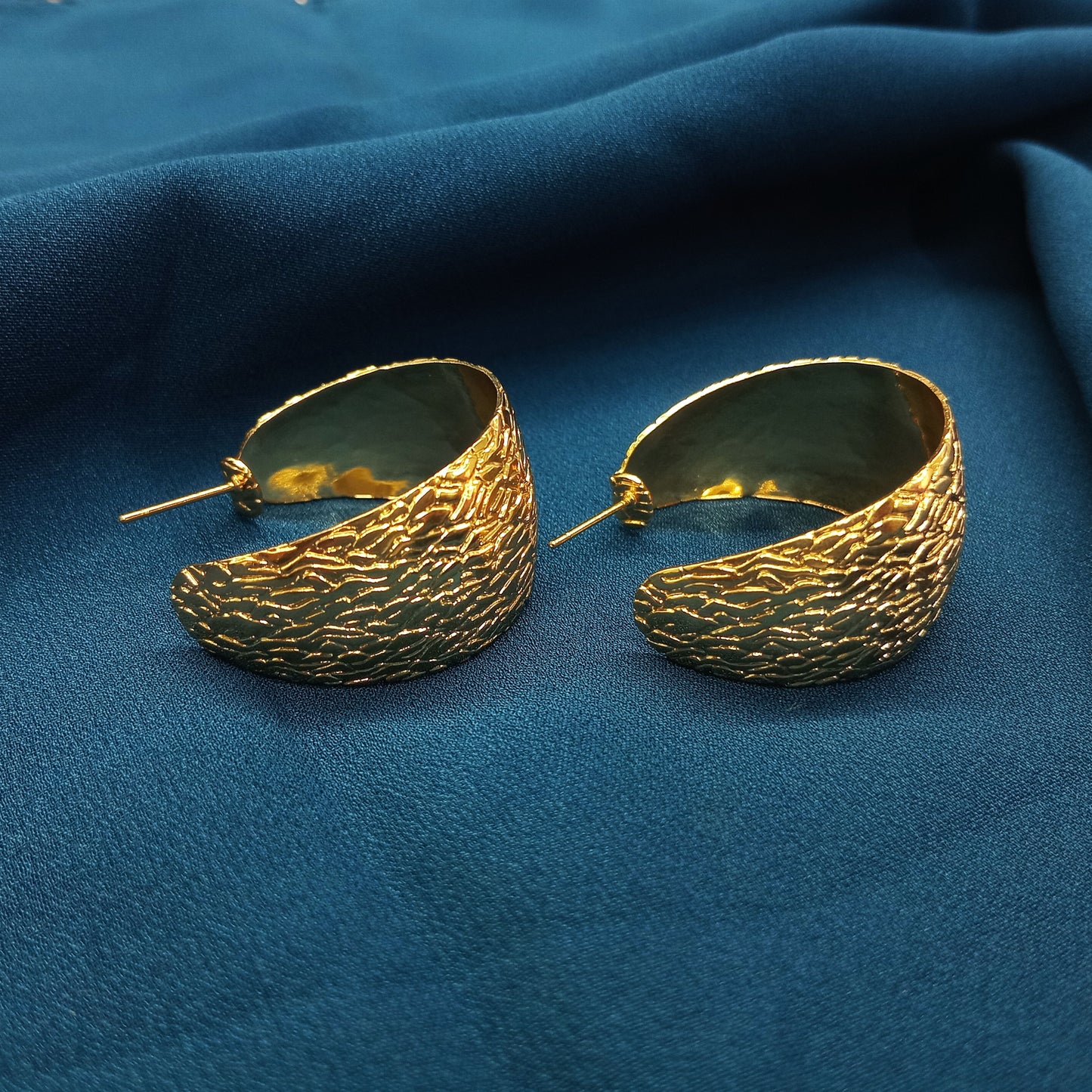 Big wide gold tone earring
