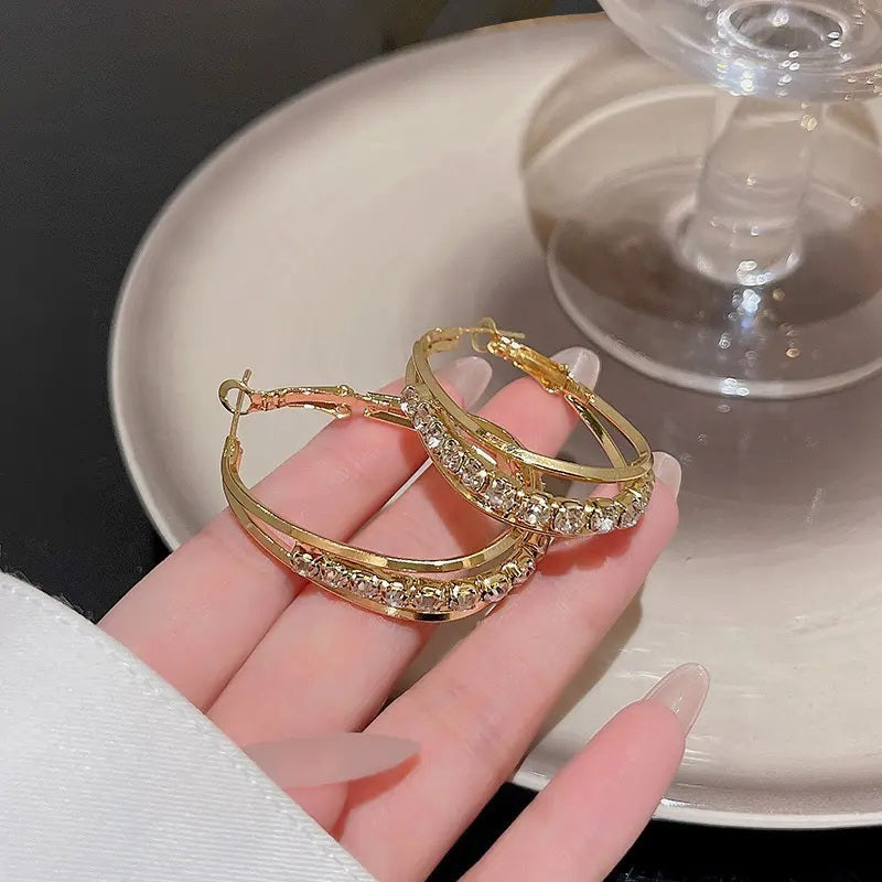 Golden shiny crystal hoop earring