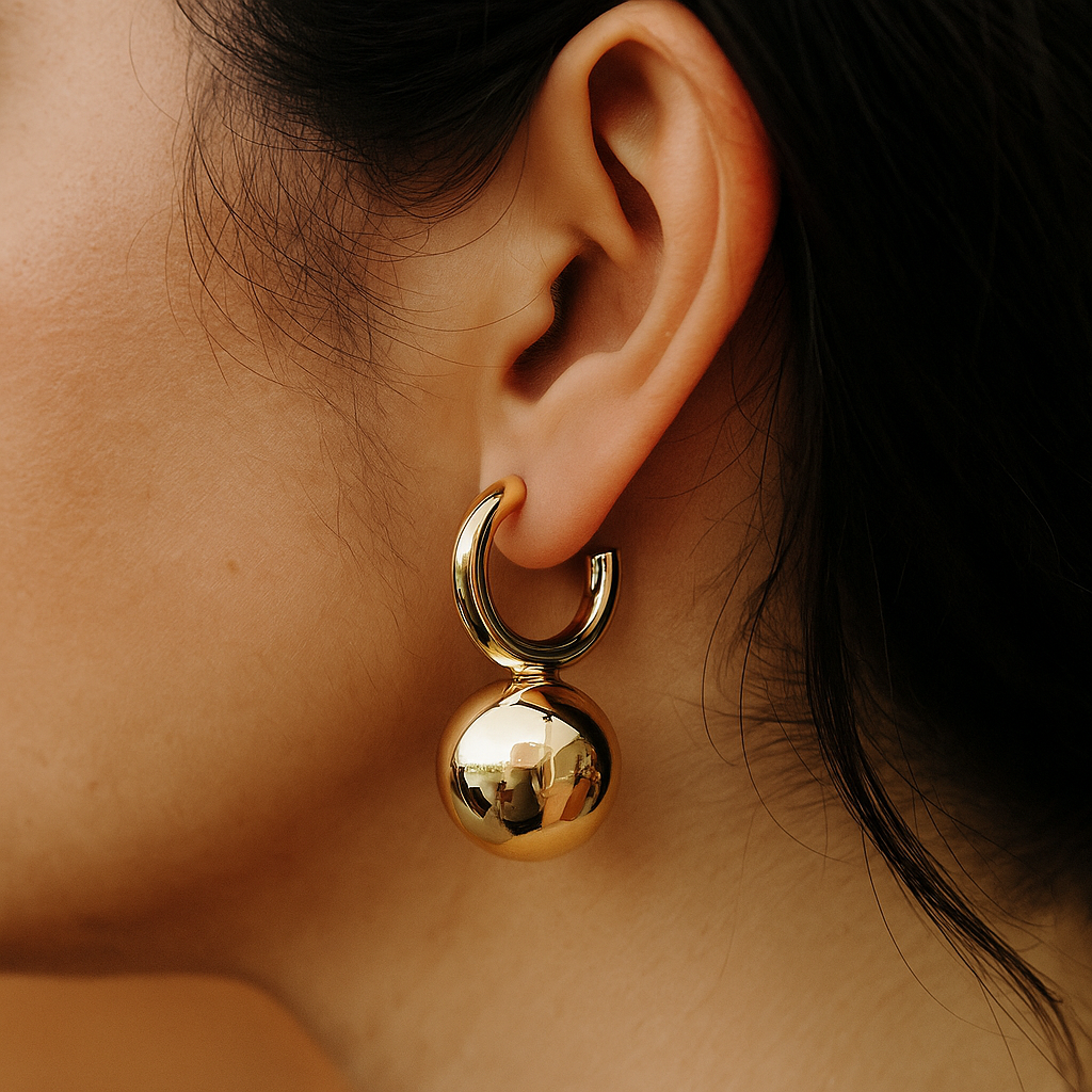 Gold ball hanging earring