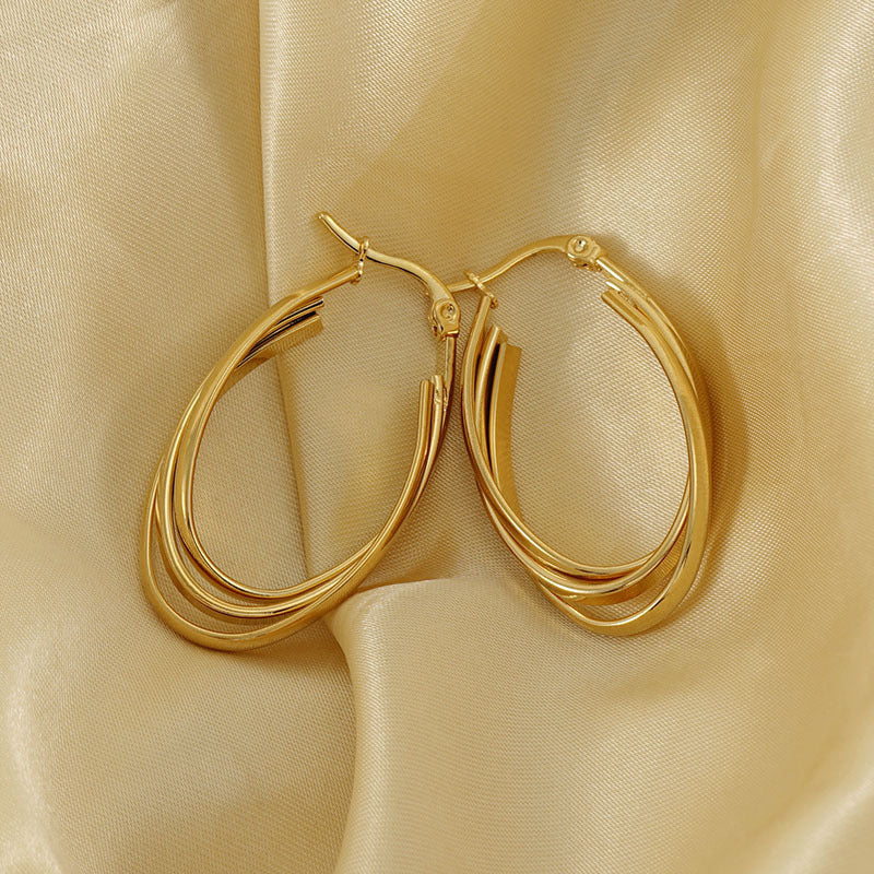Chunky twisted gold earring