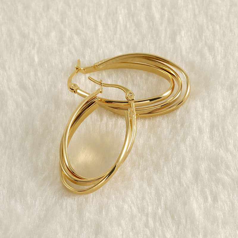 Chunky twisted gold earring