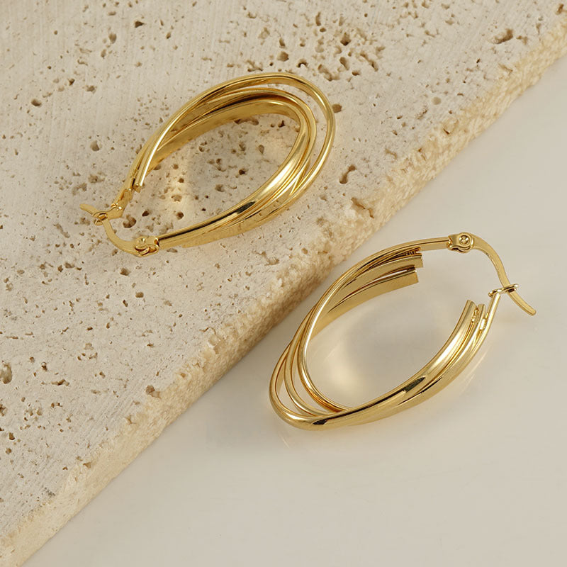 Chunky twisted gold earring