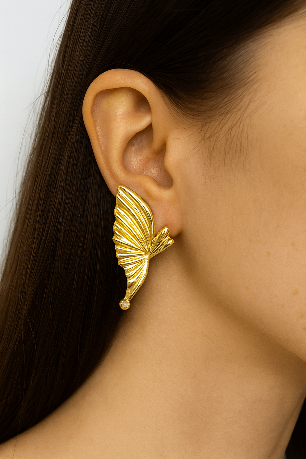 Butterfly wing style golden stud earring