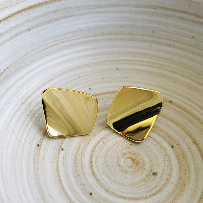 Triangle shaped gold stud earring