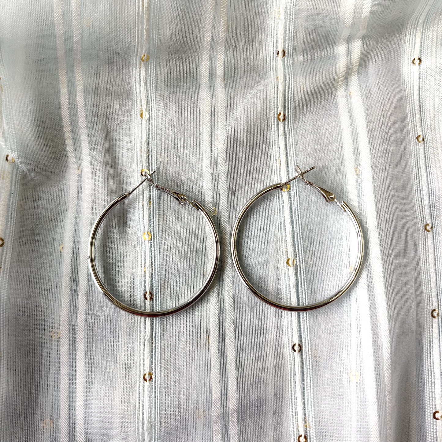 Shiny silver large hoop earring