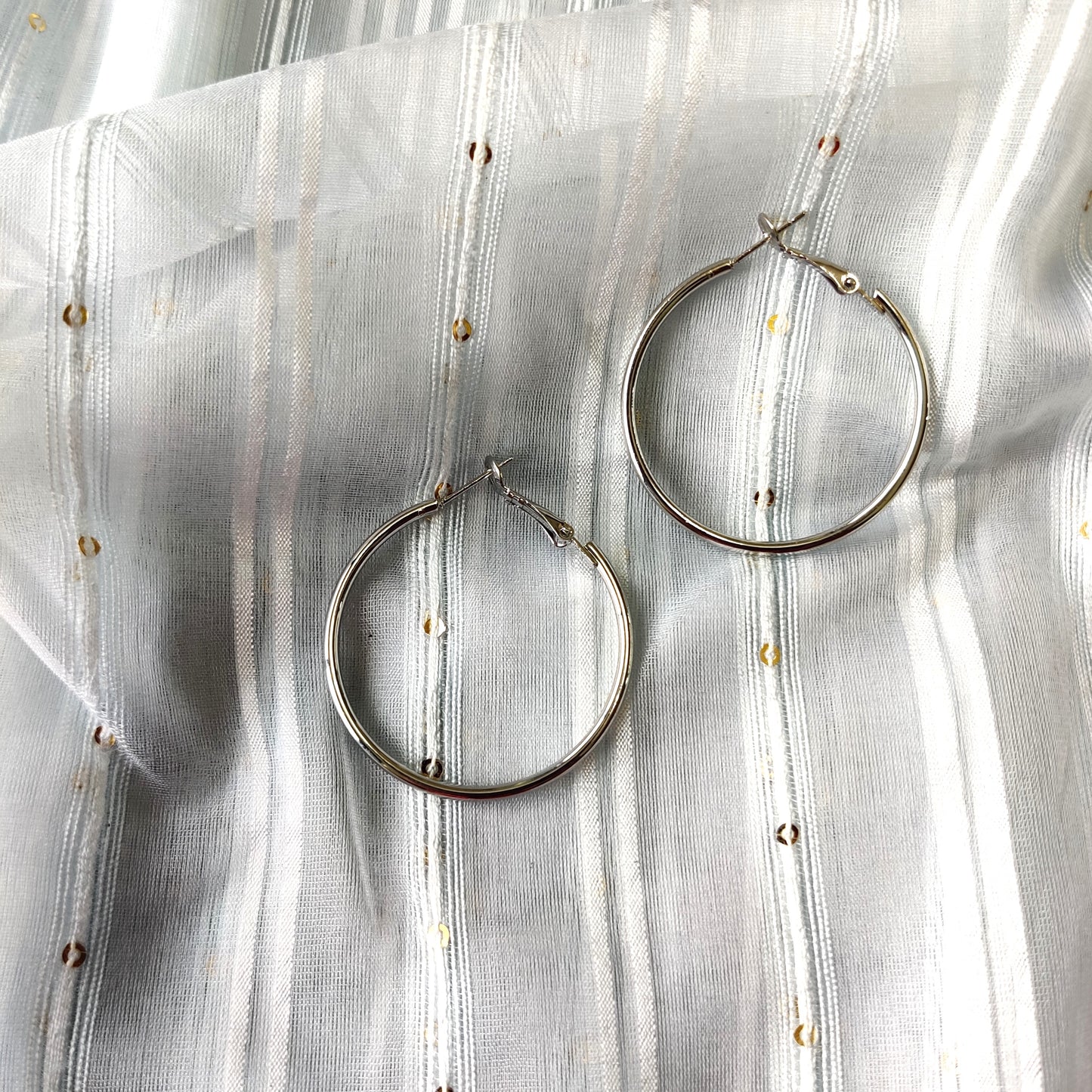 Shiny silver large hoop earring