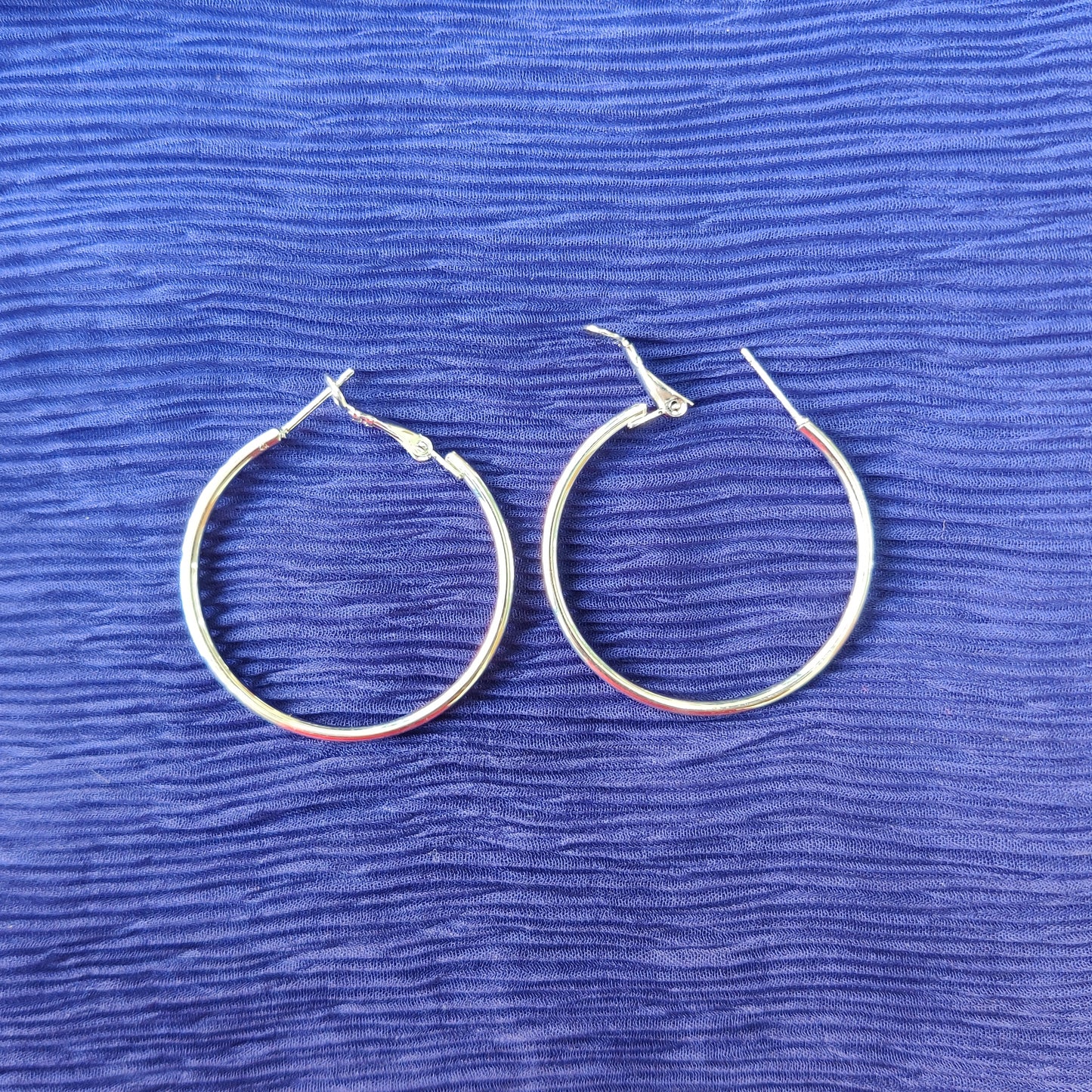 Shiny silver large hoop earring