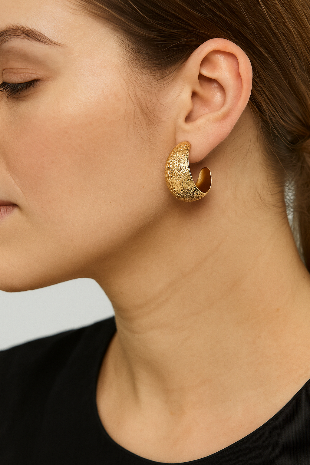 Big wide gold tone earring