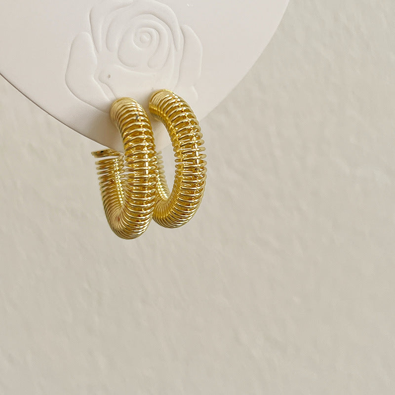 Spring design gold rooted earring
