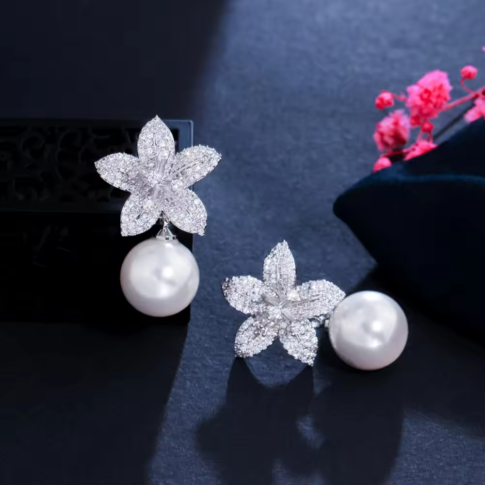 White flower pearl and diamond earring.