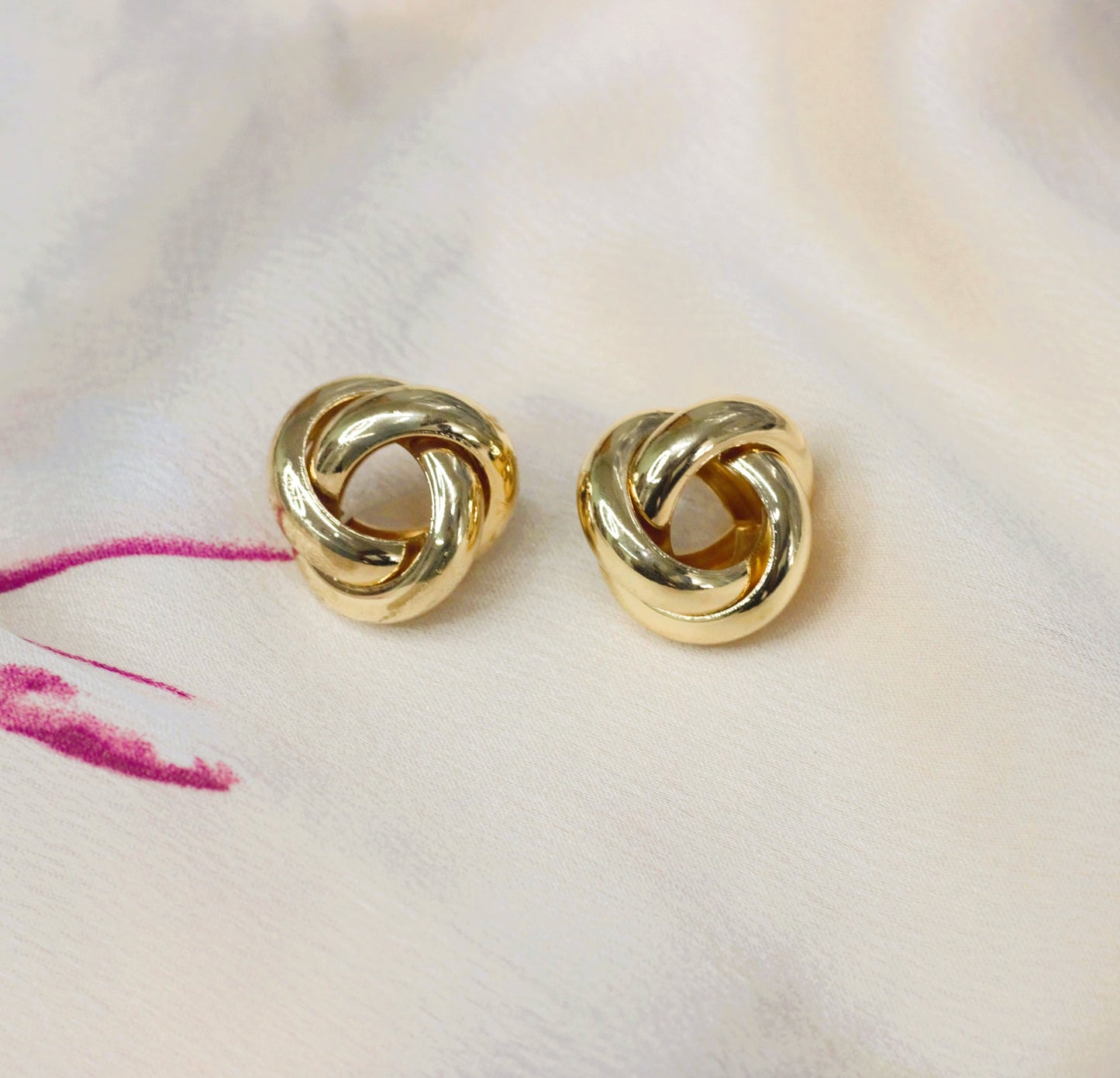 Gold twisted unique shape earring