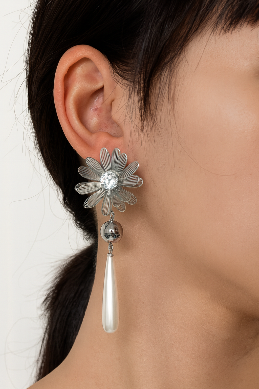 Silver sunflower with pearl drop stud earring