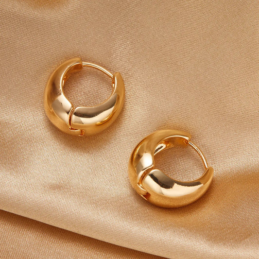 Small dropped golden hoop earring