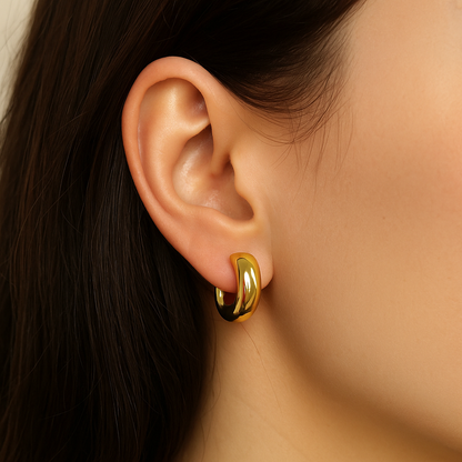 Glosy gold dangle earring