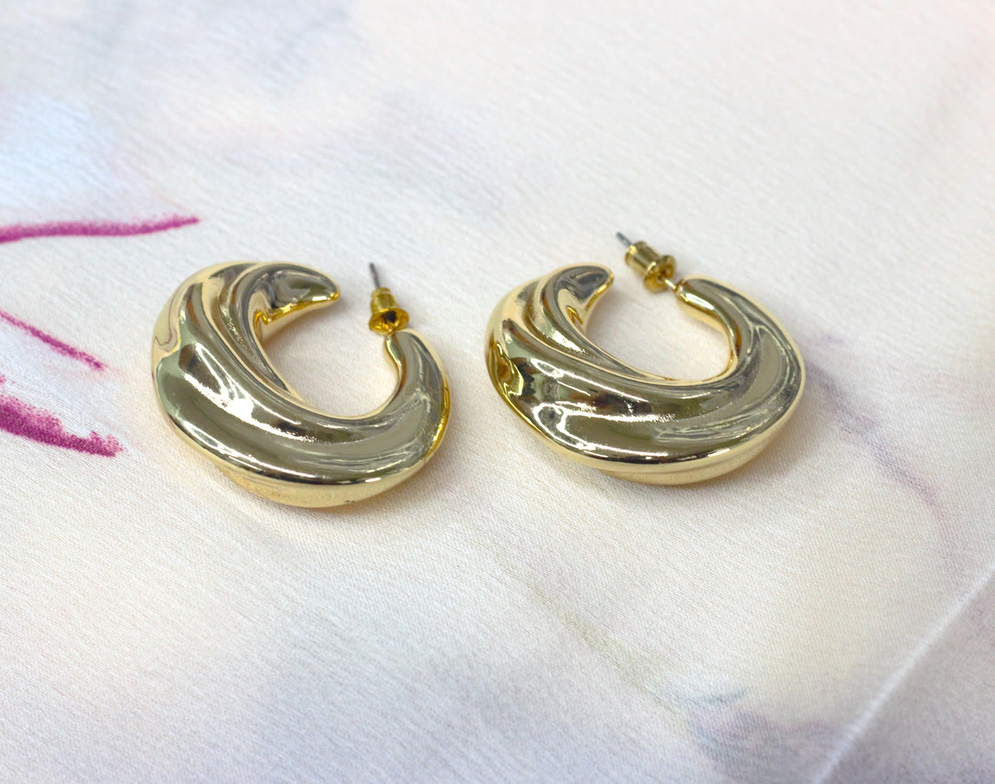 Gold C shaped twisted dangle earring