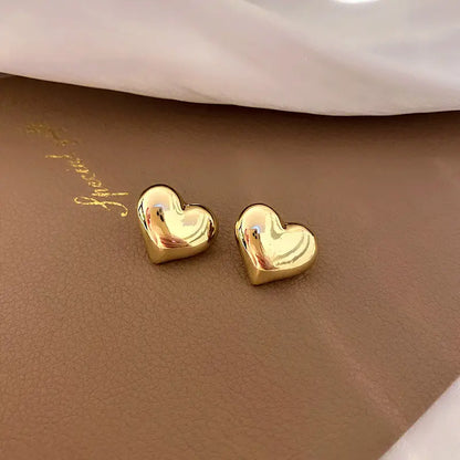 Glossy gold heart earring stud 