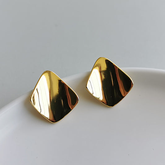 Triangle shaped gold stud earring