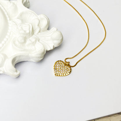 White diamond heart with golden finishing gold necklace