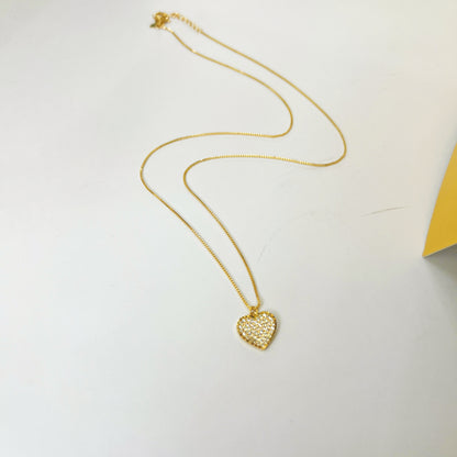 White diamond heart with golden finishing gold necklace