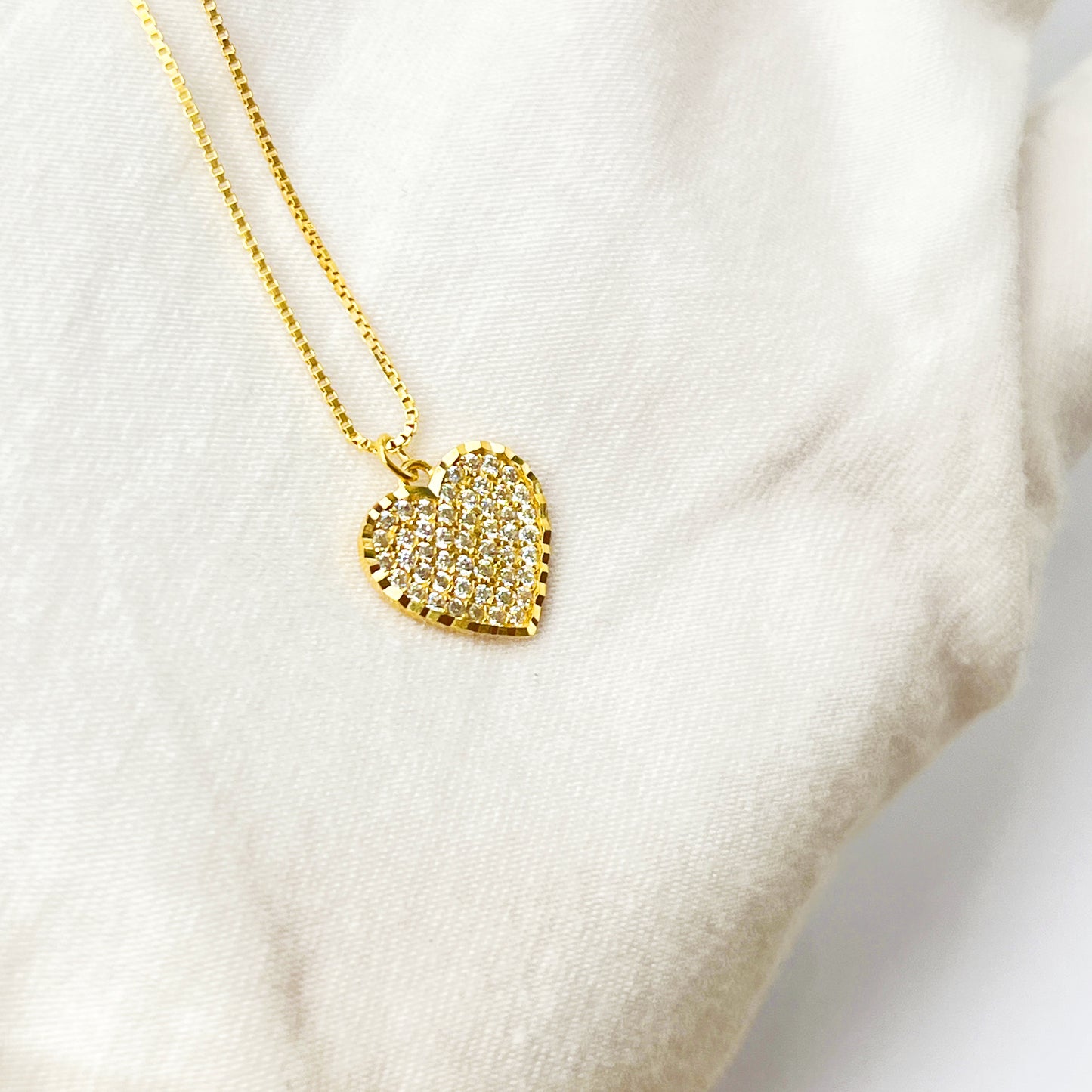 White diamond heart with golden finishing gold necklace