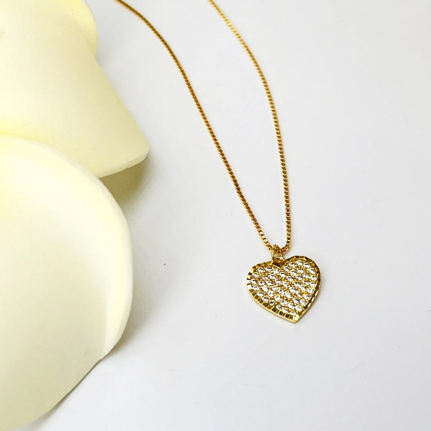 White diamond heart with golden finishing gold necklace