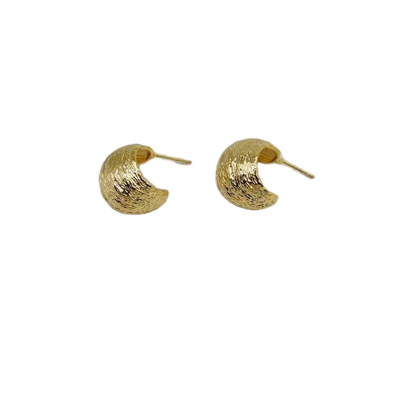 Big wide gold tone earring