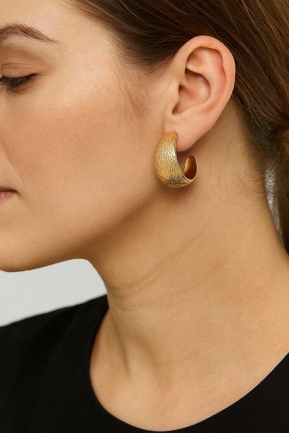 Big wide gold tone earring