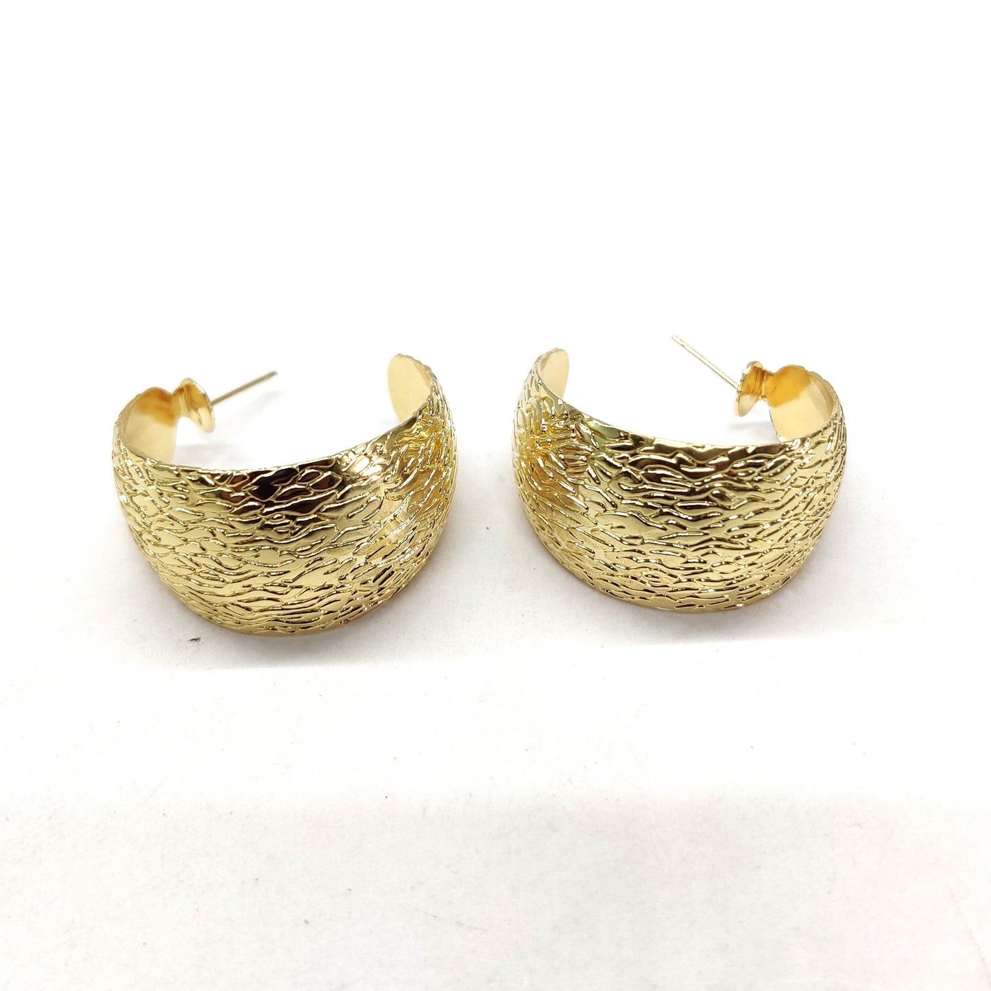 Big wide gold tone earring